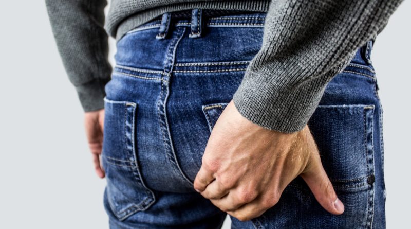 hand, blue jeans
